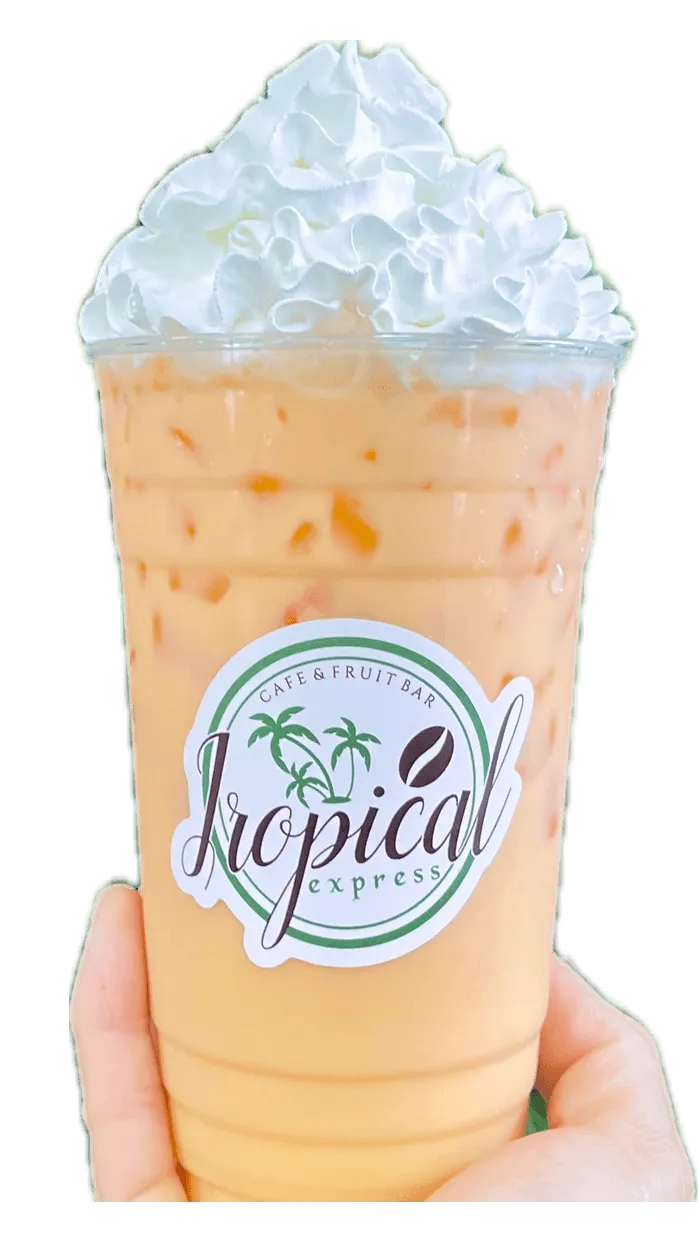 A hand holding a Tropical Express cup of Orange Creamsicle — a creamy orange and vanilla drink